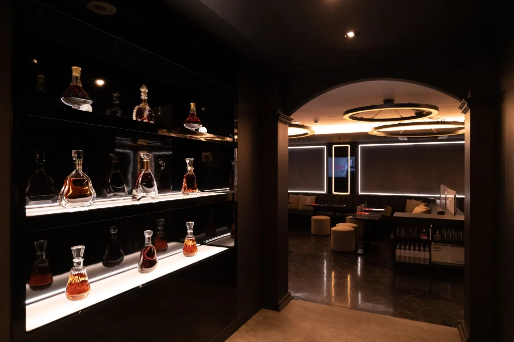 Whiskey bottles displayed inside a Japanese host club in Tokyo, showing the elegant nightlife atmosphere for foreign visitors
