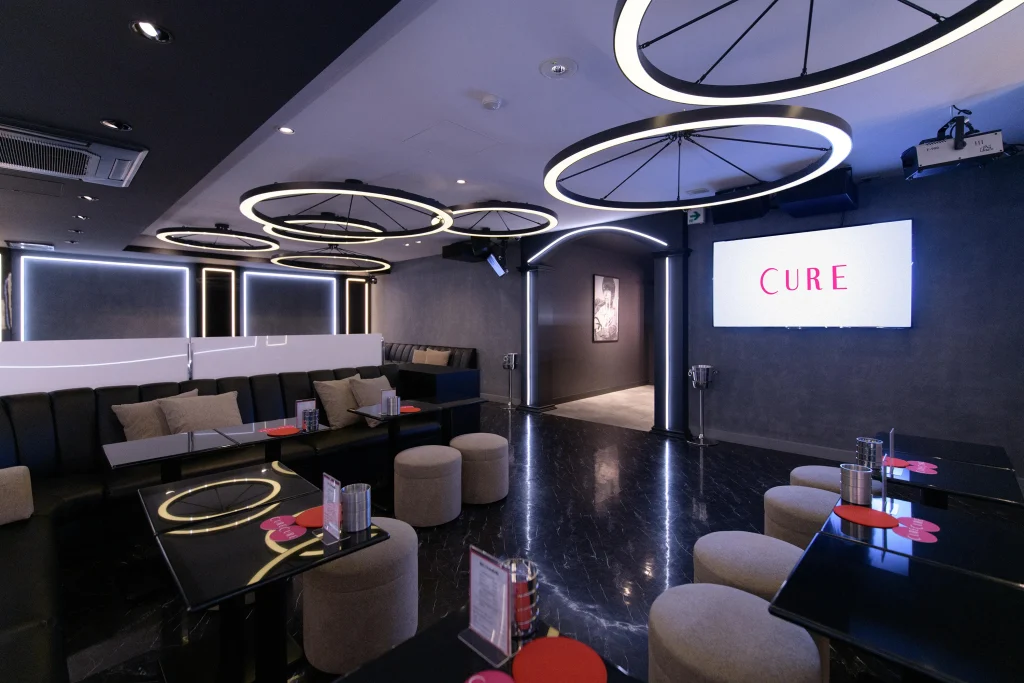 Interior of an English-friendly host club in Tokyo with modern seating and lighting