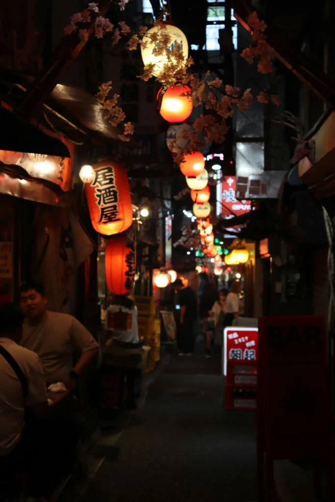 Omoide Yokocho at night with glowing lanterns and small izakaya bars in Shinjuku
