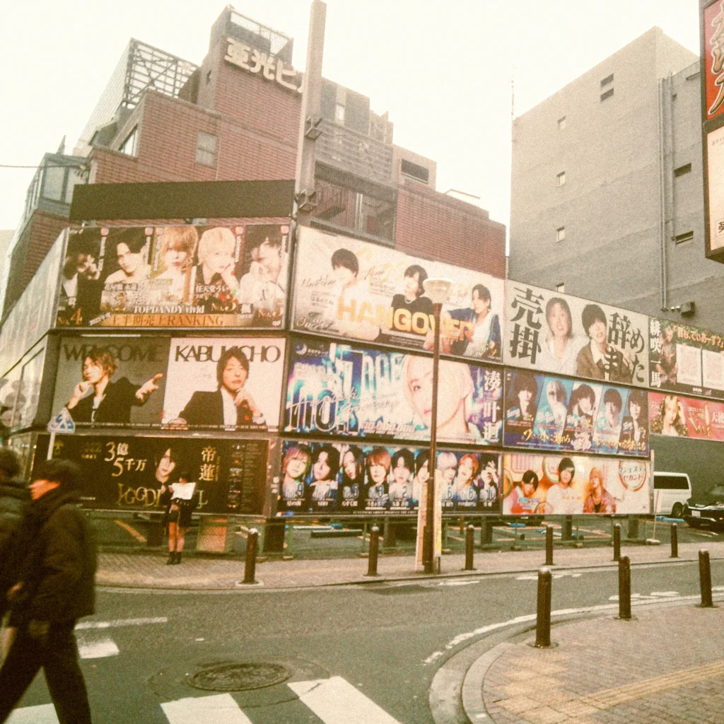 Kabukicho street lined with host club billboards and nightlife signs in Shinjuku, Tokyo