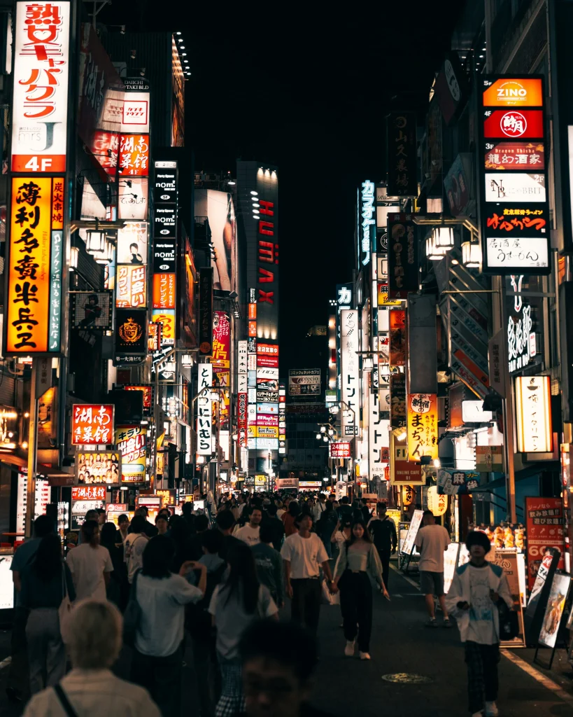 Nighttime crowd walking through Kabukicho, Shinjuku’s most famous nightlife district