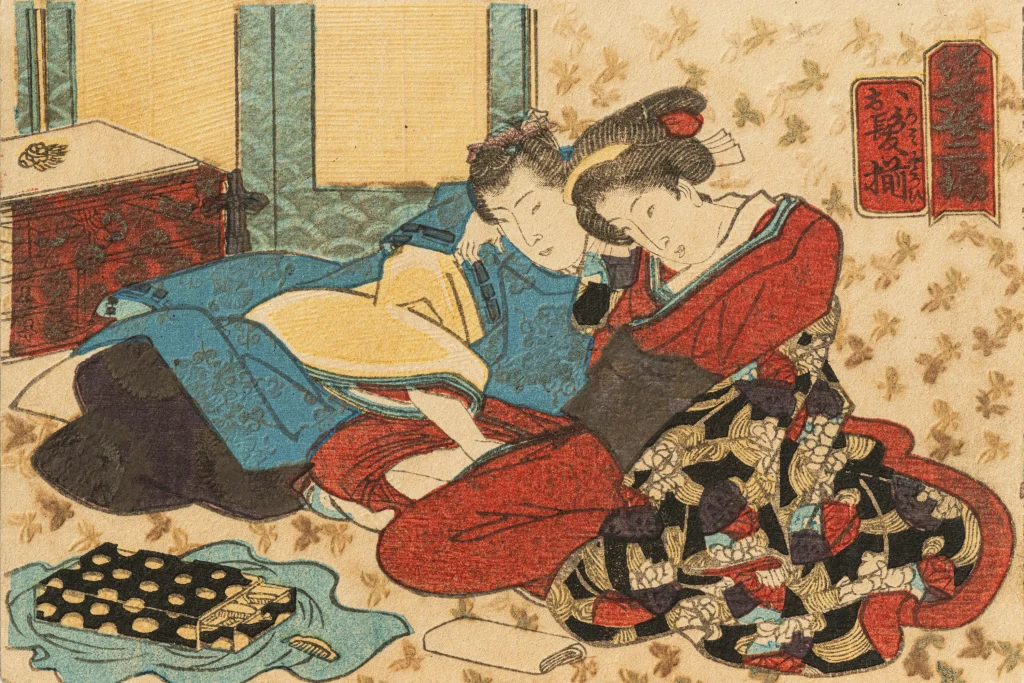 Edo period shunga woodblock print depicting affectionate interaction between two figures indoors