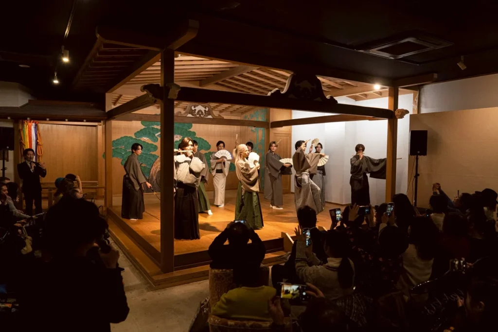 Full-stage group photo on the Kabukicho Noh stage